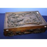 Extremely well carved Chinese wooden hardwood box of rectangular form depicting Chinese life in the