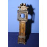 Late 19th C carved pocket watch holder in the form of a long case clock (36cm high)