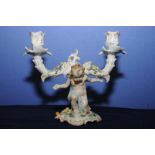 Berlin porcelain twin branch candlestick the column in the form of a cherub supporting twin