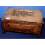 Carved oak Arts & Crafts box with hinged rectangular top with recess central carved panel depicting