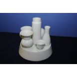 White porcelain trade display piece depicting various porcelain pieces on raised base (28cm high)