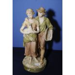 Large Royal Dux figural group depicting courting couple the lady carrying a lamb and the man with a