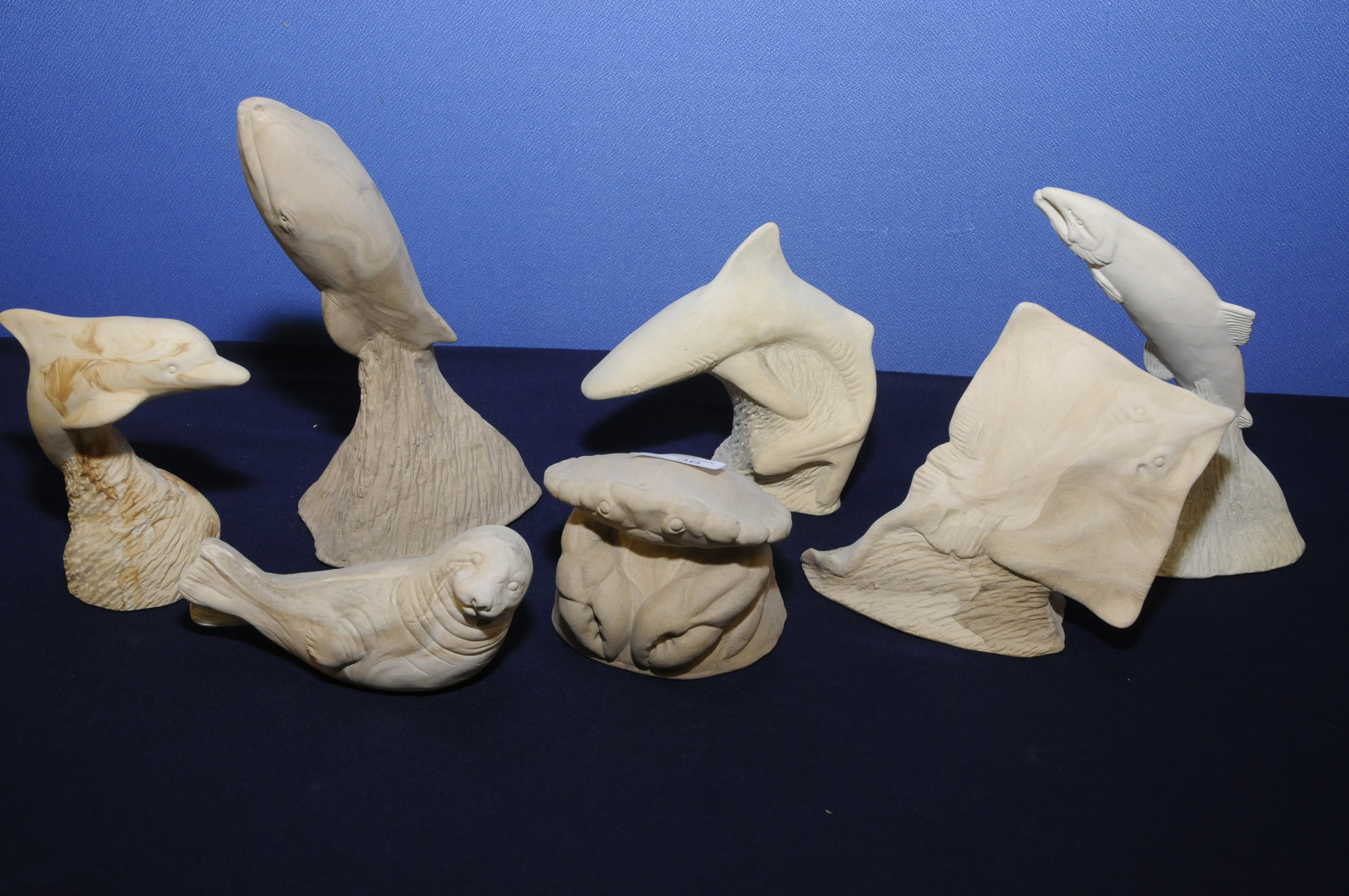 Group of contemporary artists unglazed sculptures of marine animals including ray, crab, seal,