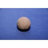 Early example of a golf ball (diameter approx 4cm)