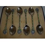 Cased set of silver hallmarked teaspoons with enamel work detail to the handles