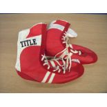 Pair of red title boxing boots singled by various boxers including Bill Chambers, Davey Holland,