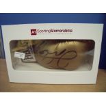 Display box with signed golden boxing glove of Floyd Mayweather