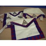 Three Masonic aprons with insignia