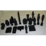 Selection of matt black plaster Egyptian figures including obelisk, busts, animals etc.