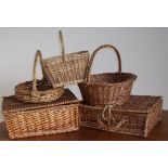 Two wicker picnic baskets and three wicker baskets