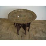Indian brass topped table with peacock detail with folding stand