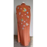 Female mannequin on stand (lacking head) with silk Kimono embroidered with various butterfly's and