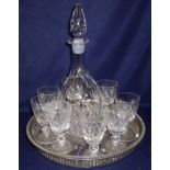 Cut glass decanter and set of eight cut glass sherry glasses on silver plated gallery tray