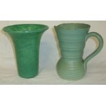 Green glass vase with flared rim and green glazed jug with ribbed effect body