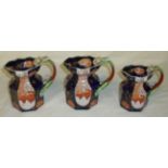 Set of three Ironstone Imari pattern graduating jugs withn serpent moulded