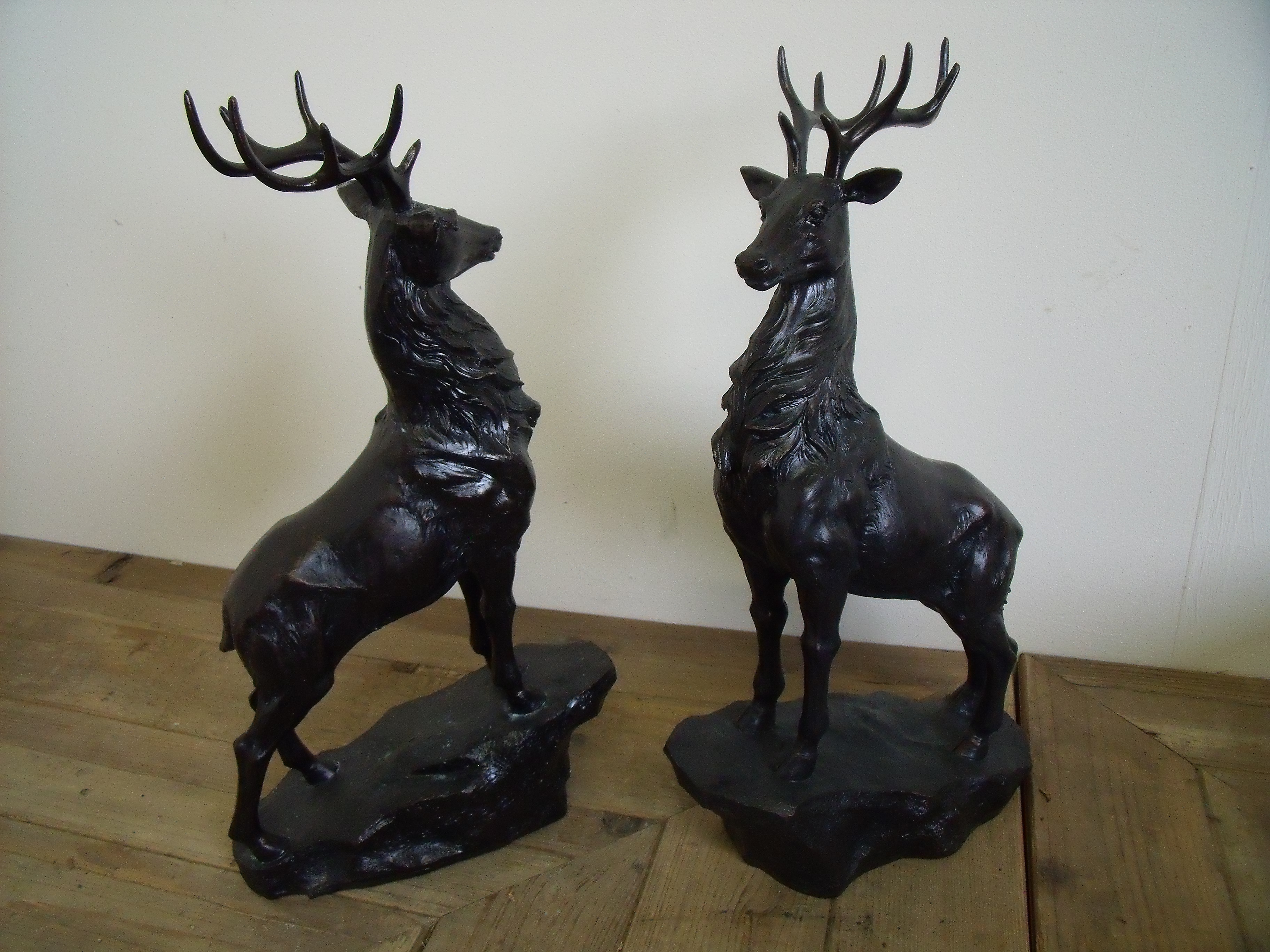 Pair of stags on rocky outcrop bases