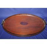 Edwardian mahogany inlaid oval tray with twin gilt metal carry handles (62cm x 42cm)