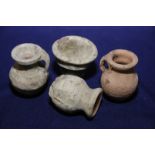 Group of four Roman period terracotta style vessels including two loop handled jugs, vase and bowl,