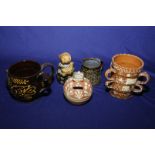 Group of assorted Slip Ware items including mugs, figure,