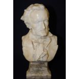 Victorian carved alabaster bust of a Wagner mounted on heavily grained alabaster base inscribed PE.