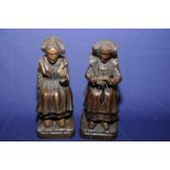 Pair of Dutch carved oak figures of seated ladies wool working,