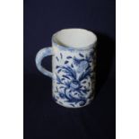 Blue and white Delft Ware tankard decorated with passion flowers and Masonic emblems,