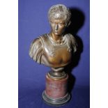 Bronze bust of a young Roman mounted on turned marble base (43cm high)