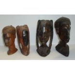 Two pairs of carved wooden tribal heads (height 15cm & 19cm)