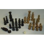 Selection of turned wooden chess pieces in small wooden box
