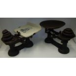 Pair of cast metal scales with ceramic transfer printed plate and one other pair of scales and