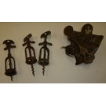 Three vintage corkscrews and brass sextant