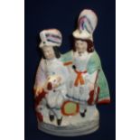 19th/20th C Staffordshire flat back figure group of a couple in native dress with musical
