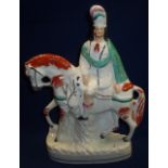 19th/20th C Staffordshire flat back figurine of a Scotsman astride his horse (height 37cm)