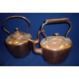 Two copper stove kettles (one with visible mend)