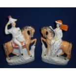 Pair of Staffordshire flat back figurines of a couple on horseback with headdress (height 23cm)