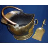 Brass coal scuttle with copper handle and brass coal shovel