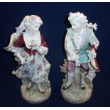 Pair of 19th/20th C Sitzendorf figurines of a Victorian couple catching butterfly's (the lady with