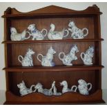 Mahogany display stand with a selection of blue and white 'Country Friends Porcelain Animal