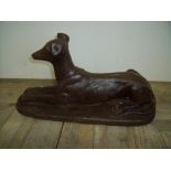 Composite figure of a reclining lurcher/greyhound type dog