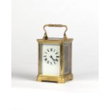 Property of a gentleman - an early 20th century brass corniche cased carriage clock timepiece,