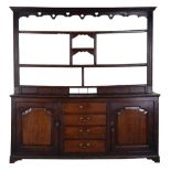 Property of a lady - an 18th century George III oak two-part Welsh dresser, 79.5ins. (202cms.)