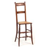 Property of a deceased estate - an early 19th century beechwood & cane seated correction chair (