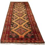 An Ardebil woollen hand-made runner with beige ground, 120 by 46ins. (305 by 117cms.) (see