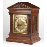 Property of a gentleman - an Edwardian carved mitre cased mantel clock, with German movement 'ting-