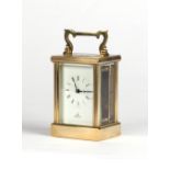 Property of a gentleman - a modern brass pillars cased carriage clock timepiece, 4.5ins. (11.