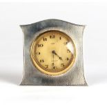 Property of a gentleman - an early 20th century silver easel cased 8-day travel clock timepiece,