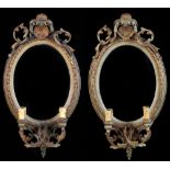 Property of a lady - a pair of late 19th century gilt & duck egg green painted composition oval