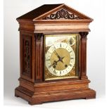 Property of a gentleman - an Edwardian carved mitre cased mantel clock, with German movement 'ting-