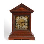 Property of a gentleman - an Edwardian carved mitre cased mantel clock, with Junghans movement '