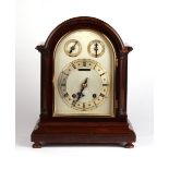 Property of a gentleman - an early 20th century arched cased mantel clock with two-train 'ting-tang'